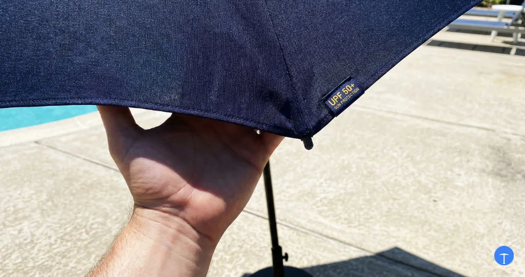 Do umbrellas block UV showing dense fabric stopping sunlight with UPF protection rating